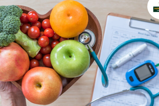 A person presents a heart-shaped plate filled with colorful fruits and vegetables, symbolizing healthy eating for diabetes management.