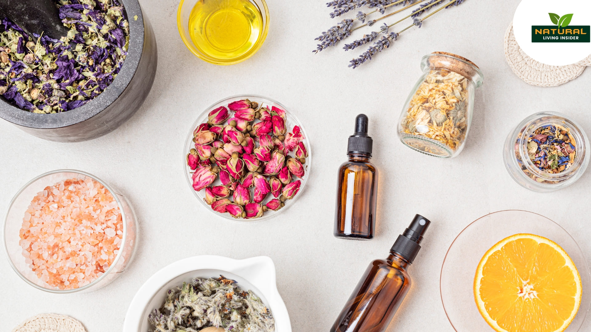 A table displays an assortment of herbs and oils, ideal for crafting organic skincare products at home.