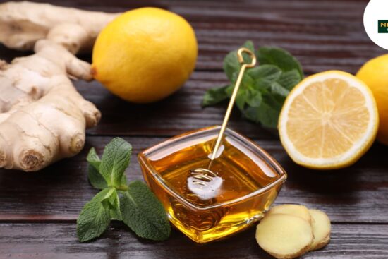 Fresh lemon and honey on a wooden table, symbolizing natural healing with herbal remedies.