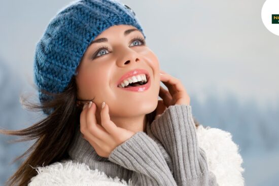 A women show the Winter Glow of her radiant skin.