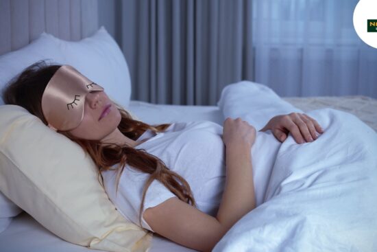 A woman in a serene sleep, illustrating the importance of sleep hygiene for well-being.