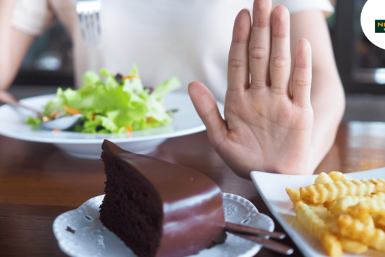 A woman gestures at a plate, highlighting arthritis-friendly food.