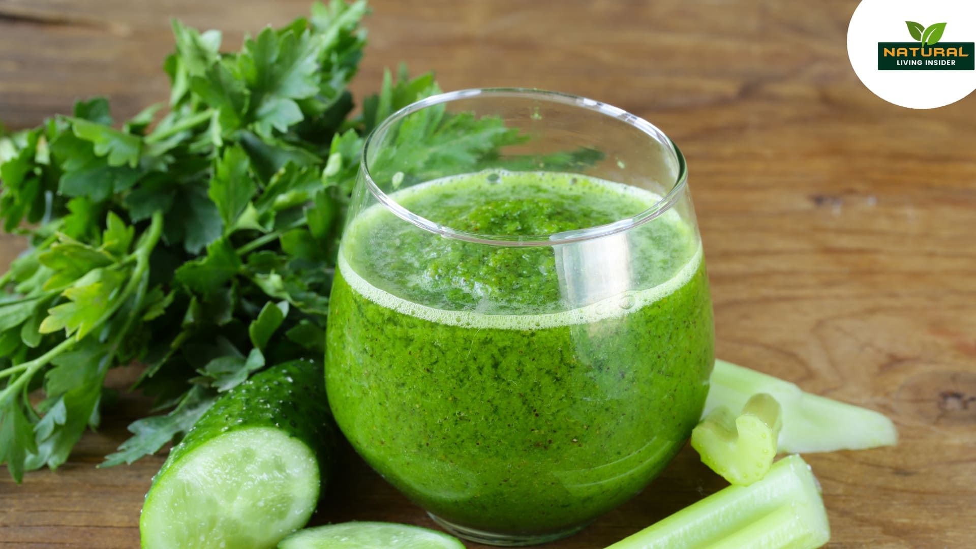 A vibrant green juice of celery on a wooden table, representing a healthy detox drink for wellness enthusiasts.